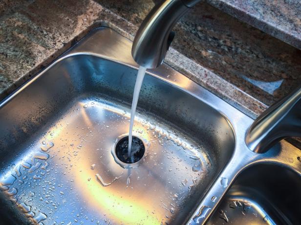 Kitchen Sink and Running Faucet