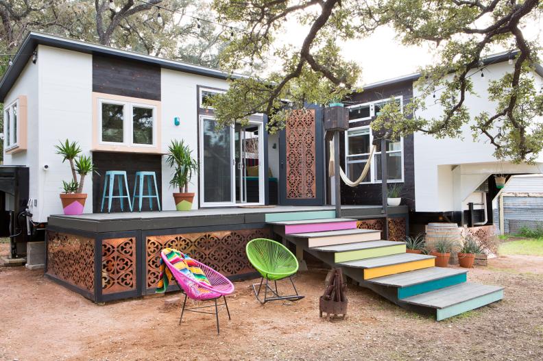 Small Eclectic Home Exterior With Colorful Stair Risers