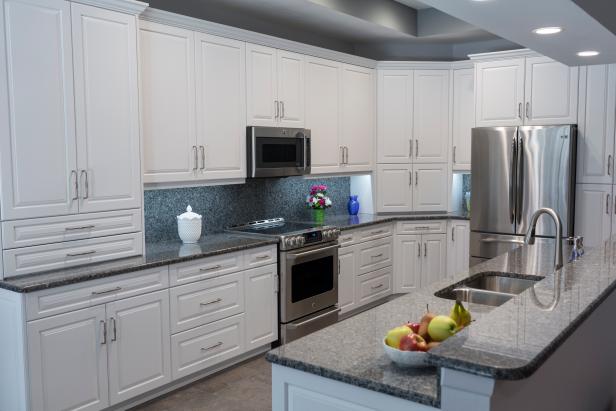 Transitional Style Kitchen With White Cabinets And A Tray