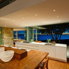 Modern Kitchen With Glass Walls And Large Island