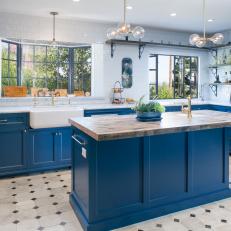 Contemporary White Kitchen with Blue Cabinets and Bay Window