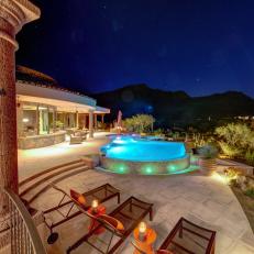 Poolside Lounge Chairs & Infinity Pool at Night