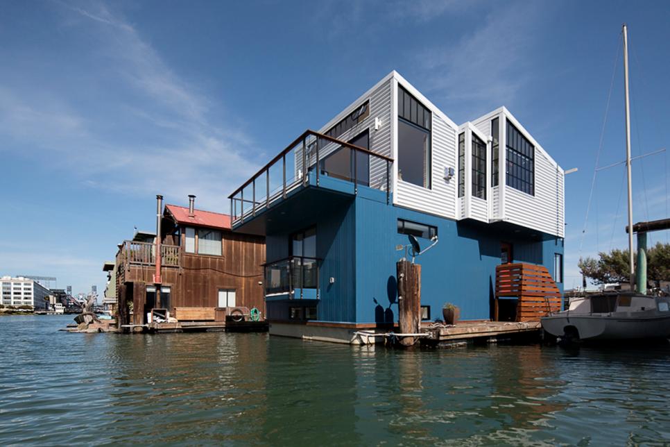 Modern Floating Home With White & Blue Metal Siding