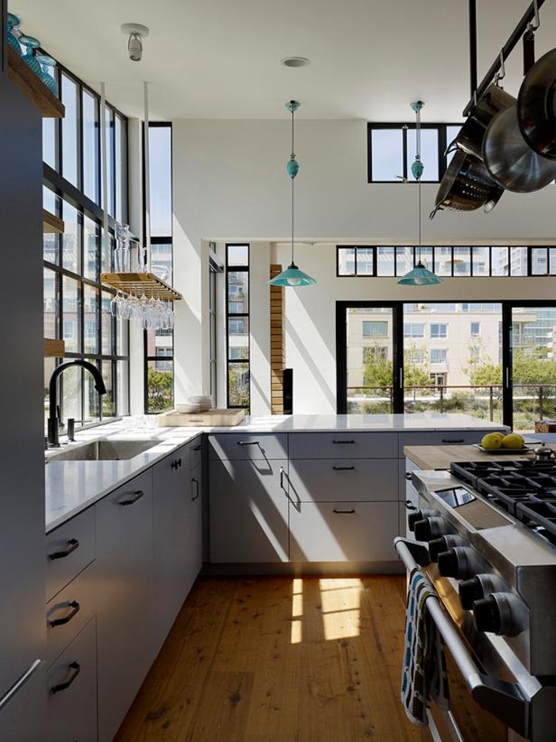 White Contemporary Kitchen With Windows & Gray Cabinets