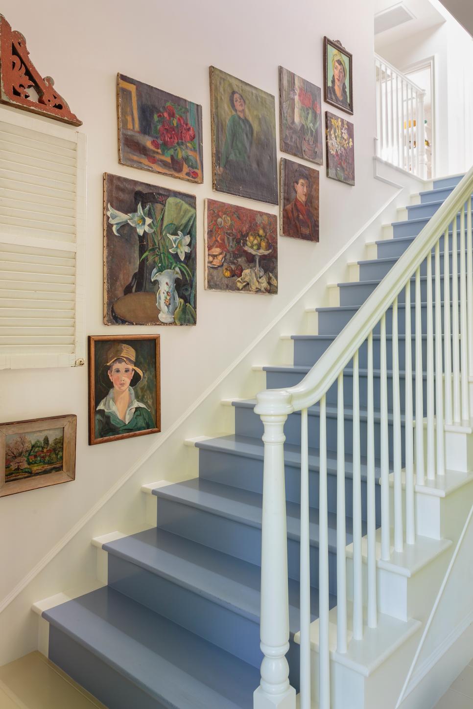 Artwork Lining the Walls of a Stairway HGTV