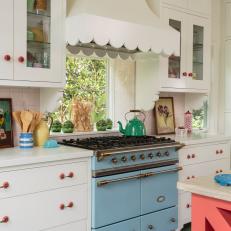 Blue Retro Double-Ovens and Scallop-Edged Ventilation System Add Personality to Colorful Kitchen 