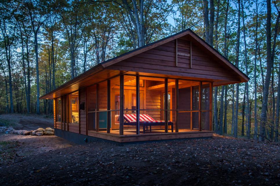 Wood Cabin With Screened Porch at Dusk