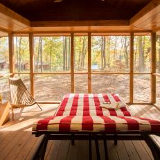 Cozy Screened Porch Is Ideal for Relaxation