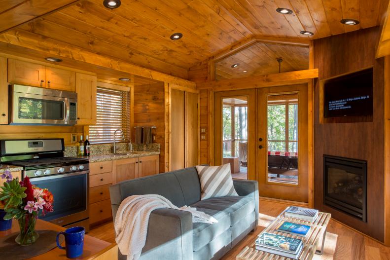Cabin Living Area and Kitchen With Pine Walls and Ceiling