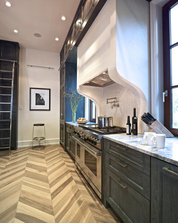 Transitional Kitchen With Dark Wood Cabinets and White Range Hood