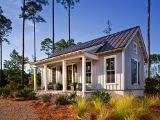 Small Home With Gray Siding and Metal Roof