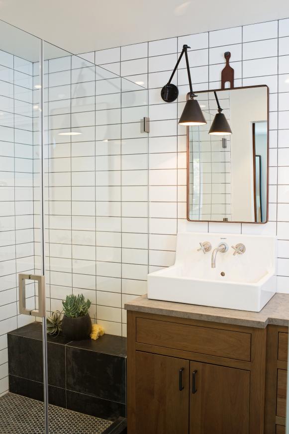 Black and White Bathroom With Wood Vanity and Tile Shower
