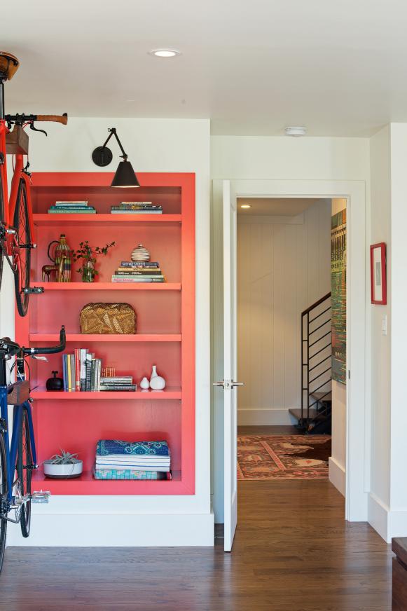 Red Built-In Bookcase in White Bedroom
