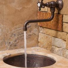 Elegant Wall Faucet & Rustic Undermount Sink