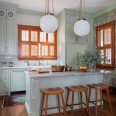 1900 Cottage-Style Kitchen with Wood Trim and Accent Wall 