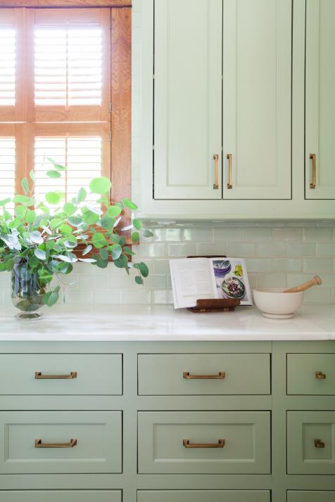 Sage green kitchen in a renovated Victorian home, Southport