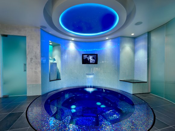 Blue Tile Hot Tub With Flat-Screen TV