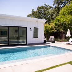 Swimming Pool With Contemporary Black & White Pool House