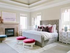 A client with four young children wanted a serene master suite that could comfortably fit her new family. Designers Kirsten Krason and Erin Morgan introduced multifunctional furniture and colorful accents to create an inviting setting.
