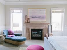 Neutral Transitional Bedroom With Wainscoting, Fireplace & Blue Chaise