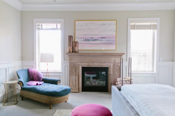 Neutral Transitional Bedroom With Wainscoting, Fireplace & Blue Chaise