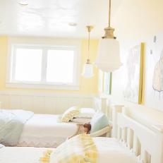 Girls' Bedroom With Soft Yet Cheery Yellow Walls