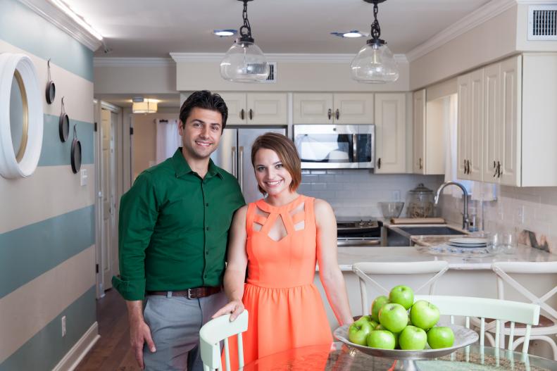 Contestants Nick and Sara pose in their newly renovated Gulf Dreams condo, which features traditional style with fun nautical details. 