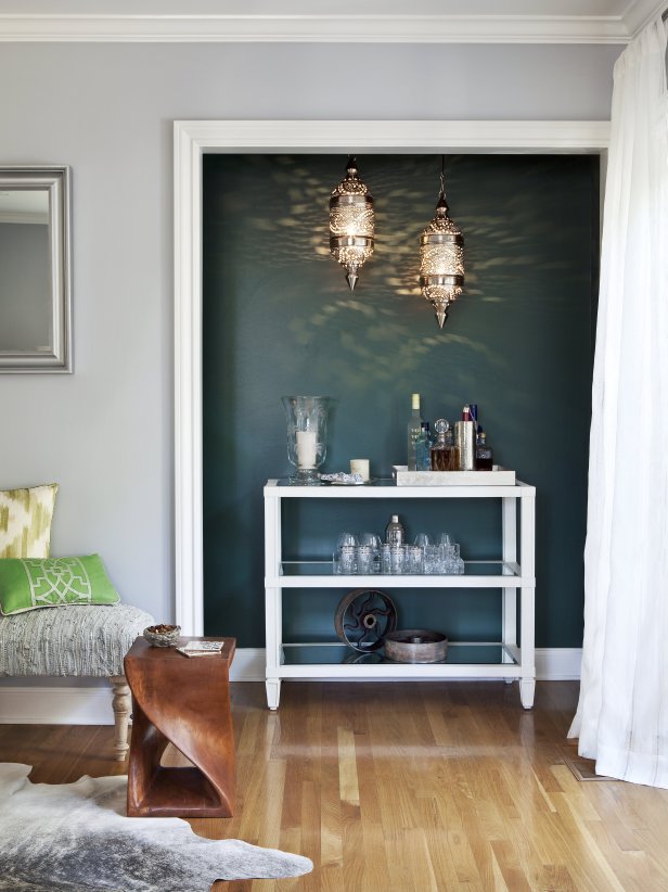 Bar cart niche within doorway of a living room. 