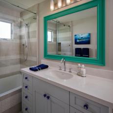 White Small Bathroom With Blue Mirror