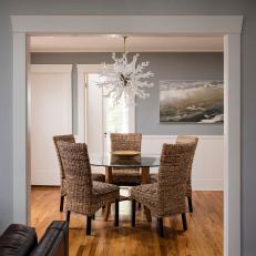 Gray Coastal Dining Room With Wicker Chairs