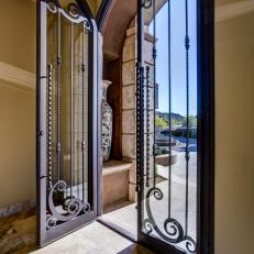 Home Entryway with Tall Glass and Wrought Iron Door
