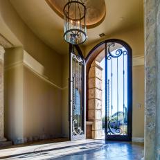 Home Entry and Foyer with High Ceiling and Wrought Iron and Glass Doors