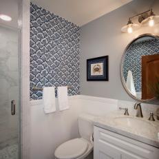 Blue and Gray Coastal Bathroom With Wave Wallpaper