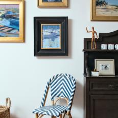 Coastal Gallery Wall and Striped Wicker Chair