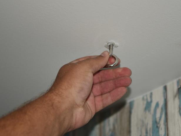 Youâll need to install drywall anchors, unless you are attaching your hardware directly into a stud or ceiling joist. Pre-drill holes for the anchors with a half inch bit, then tap or push the anchors into place.  Next, screw the eye bolts into the anchors. Make sure your anchor thread dimensions match the eye bolt thread dimensions or the bolts will not screw in properly.