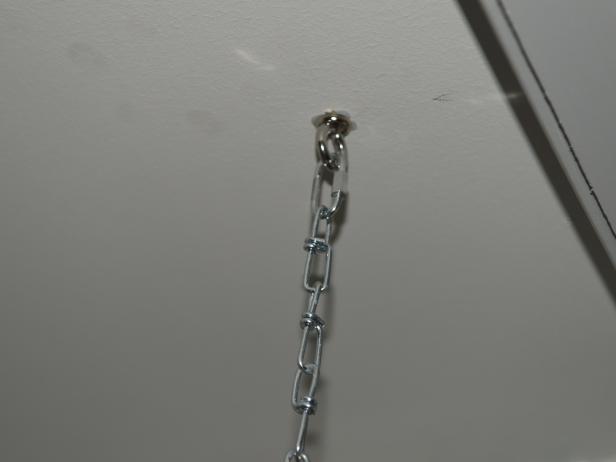 Once the eye bolts are installed on both the ceiling and the ladder, you can attach the light duty chains. We had the chains cut into 4inch lengths at a home improvement center, then added the locking links at the ends. Attach the chains to the ceiling first, then the ladder. Of course you can adjust the chain length to accommodate any rack or ceiling height.