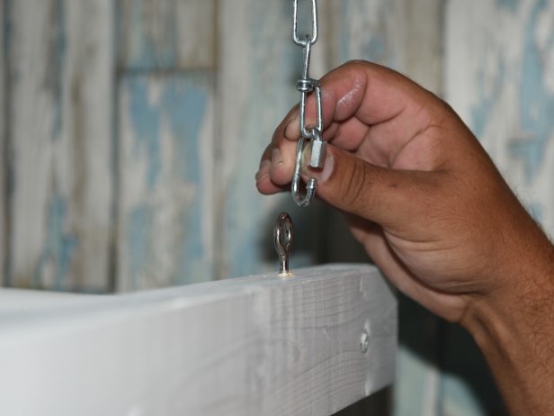 Once the eye bolts are installed on both the ceiling and the ladder, you can attach the light duty chains. We had the chains cut into 4inch lengths at a home improvement center, then added the locking links at the ends. Attach the chains to the ceiling first, then the ladder. Of course you can adjust the chain length to accommodate any rack or ceiling height.