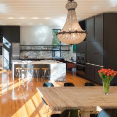 Contemporary Kitchen and Dining Area With Vintage Chandeliers