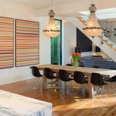 Open Dining Area With Multicolor Art and Vintage Chandeliers