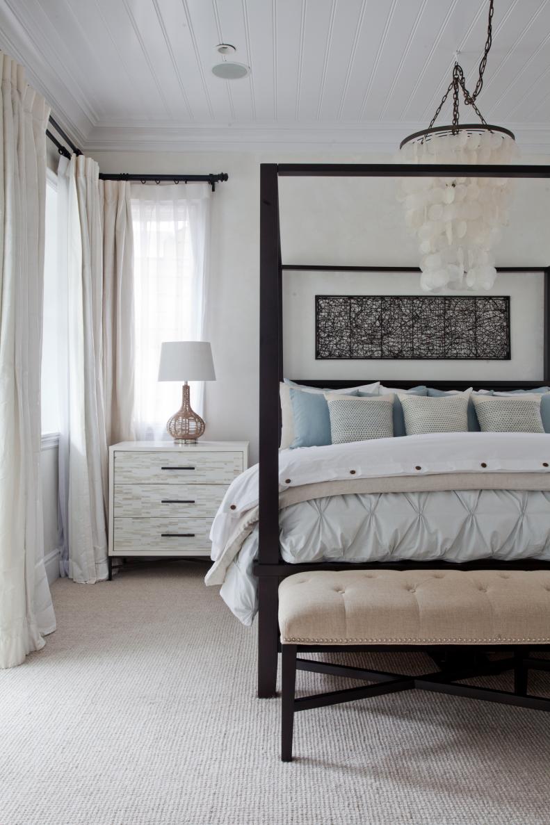 Contemporary Bedroom With Black Canopy Bed & Light Blue Accents