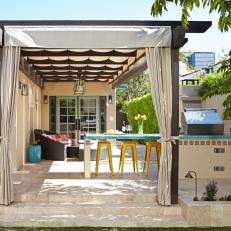 Spanish-Inspired Patio With Seating, Grilling and Dining Areas