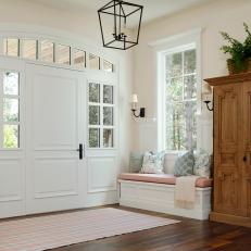 White Foyer with Contemporary Styling and White, Upholstered Storage Bench
