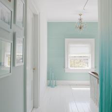 Blue Hall With White Wood Floors