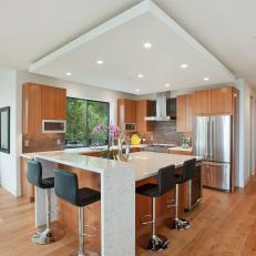 Black Leather Barstools at Large Island in Open Kitchen
