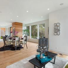 Open, Contemporary Living Room With Central Dining Room
