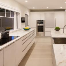 Modern Kitchen With White Cabinets & Marble Countertops