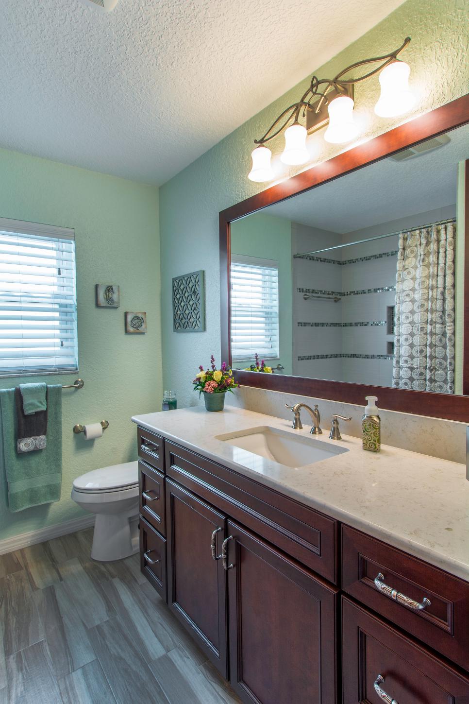 Green Transitional Style Bathroom With Wood Vanity And Mounted Light ...