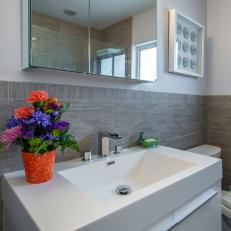 Gray Bathroom With Modern Vanity and Fixtures 