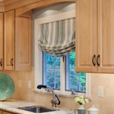Contemporary Kitchen with Blue and Neutral Striped Roman Shades