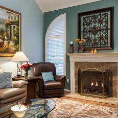 Transitional Style Blue Living Room with Granite Fireplace Surround